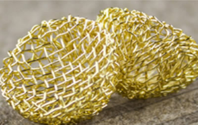 The picture shows two brass bowl tobacco screen meshes.