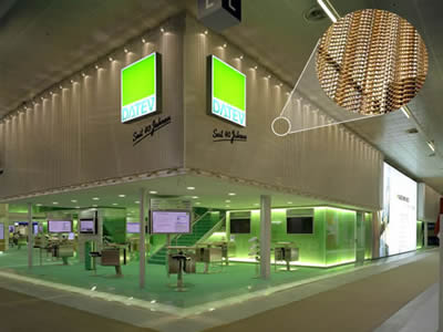 Brass weave decorative mesh is installed for wall decoration in the building.