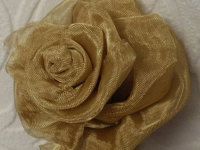 A brass wire cloth flower on the paper.