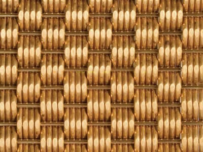A brass tidal opaque woven decorative mesh.