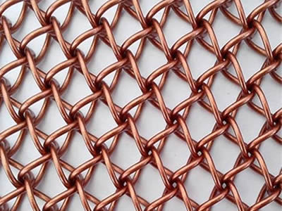 This is a woven copper honeycomb decorative mesh.