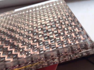 This is a copper decorative wired glass mesh which inlay is multi-layer copper weave meshes.