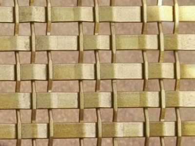 Three thin brass wires in wrap and a thick wires in weft in the style of lock crimped wire mesh composes a decorative mesh.