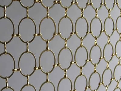 This is a woven brass ring decorative mesh.