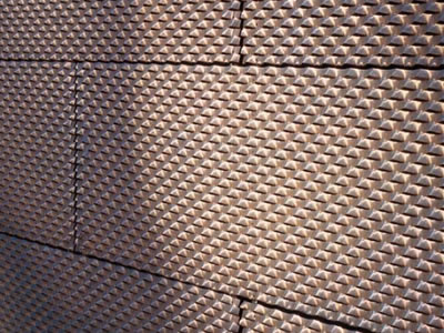 The picture shows a wall of expanded metal mesh.