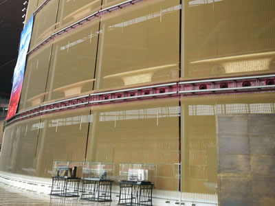 Facade mesh with brass ropes and rods is installed in Beijing Grand Theater as a theater wall.