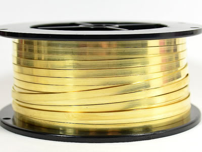 Flat brass wire winds on plastic black spool.