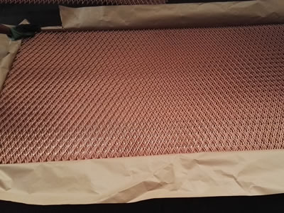 The picture shows heavy expanded metal mesh panels in water proof paper.