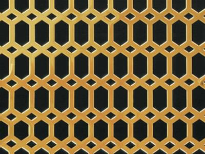 The picture shows a piece of honey comb brass perforated mesh.