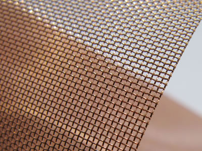 A plain weave copper insect screen with many meshes.