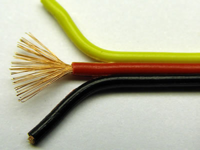 The picture shows black, red, yellow insulated copper wire which has many thin copper wires.
