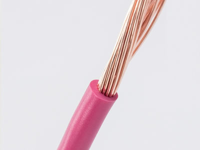 The picture shows many copper wires in pink PVC coating.