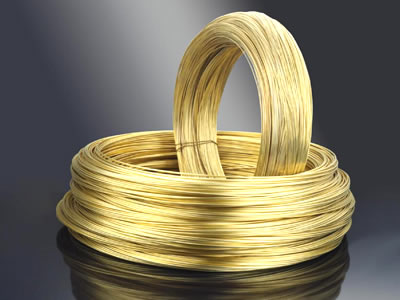 The picture shows two coils of brass wire.
