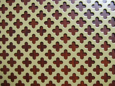 The picture shows a piece of small club brass perforated mesh.
