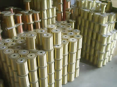 The picture shows many spools of fine brass wire.